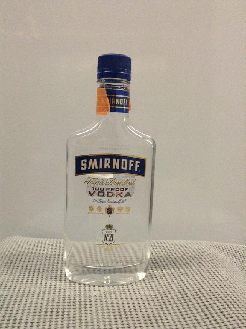 Smirnoff Vodka Triple Distilled 375 ML: Any contents in bottle is Free; You are bidding on the bottle & unbroken tax stamp