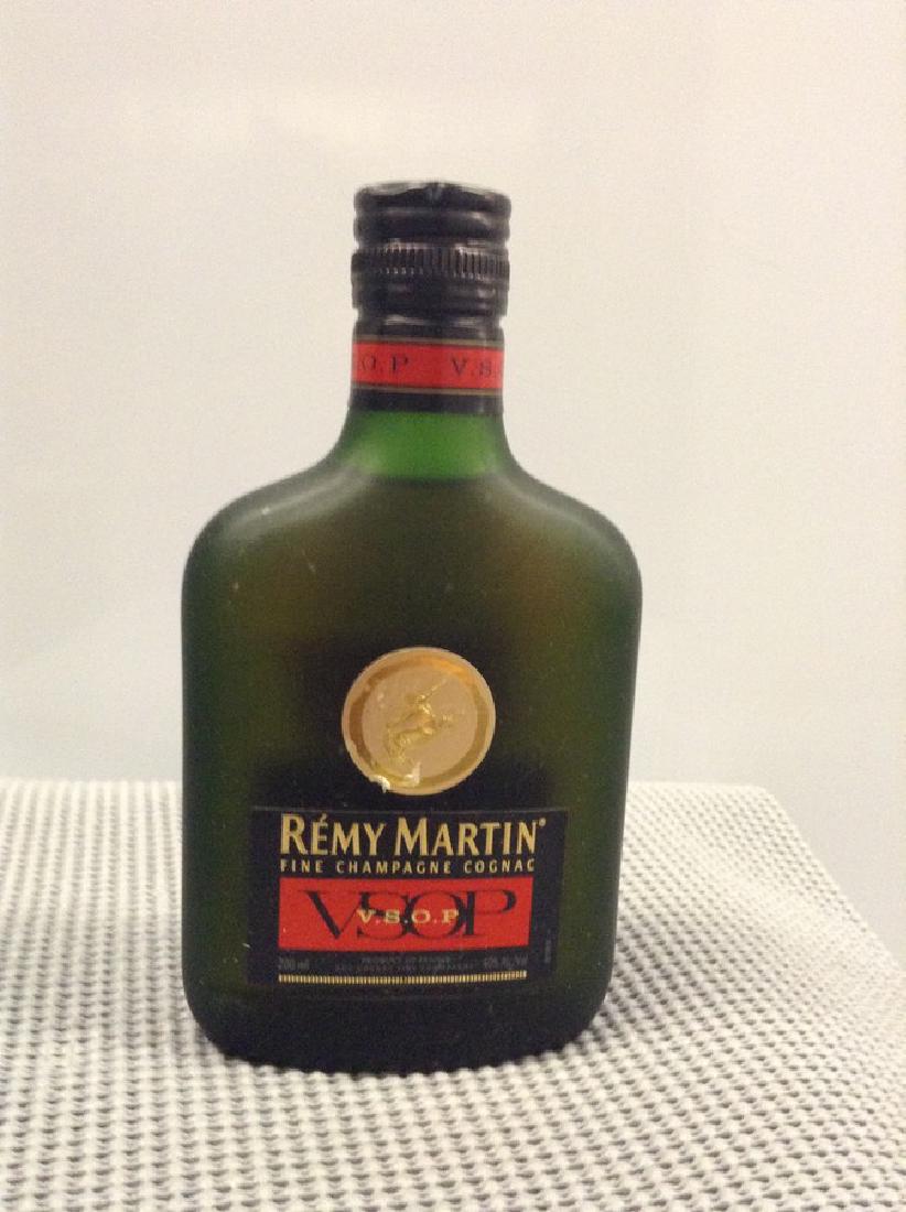 Remy Martin Champagne Cognac VSOP 200 ML: Any contents in bottle is Free; You are bidding on the bottle & unbroken tax stamp