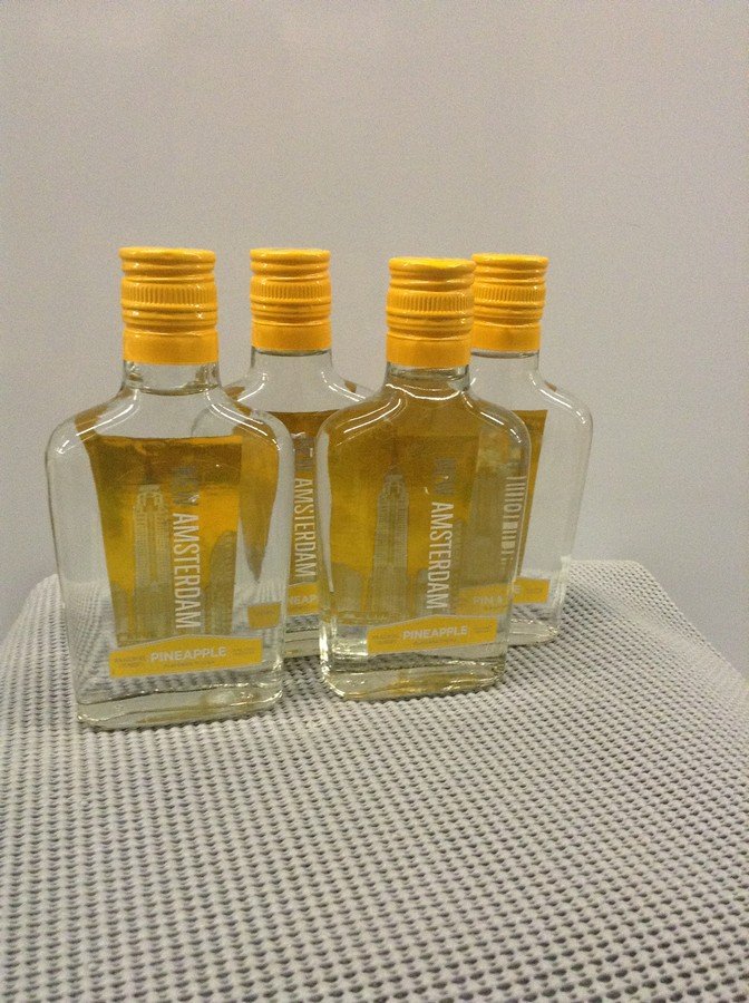 New Amsterdam Pineapple Vodka 200ML: Any contents in bottle is Free; You are bidding on the bottle & unbroken tax stamp