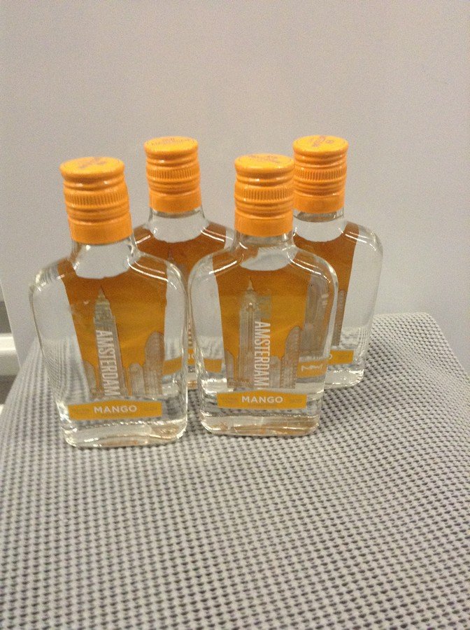 Lot of 4 New Amsterdam Mango Vodka 200ML: Any contents in bottle is Free; You are bidding on the bottle & unbroken tax stamp