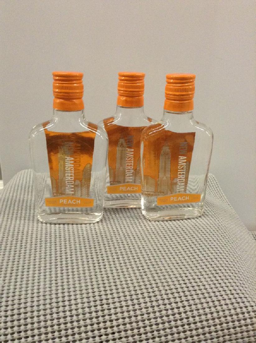 Lot of 3 New Amsterdam Peach Vodka 200ML: Any contents in bottle is Free; You are bidding on the bottle & unbroken tax stamp