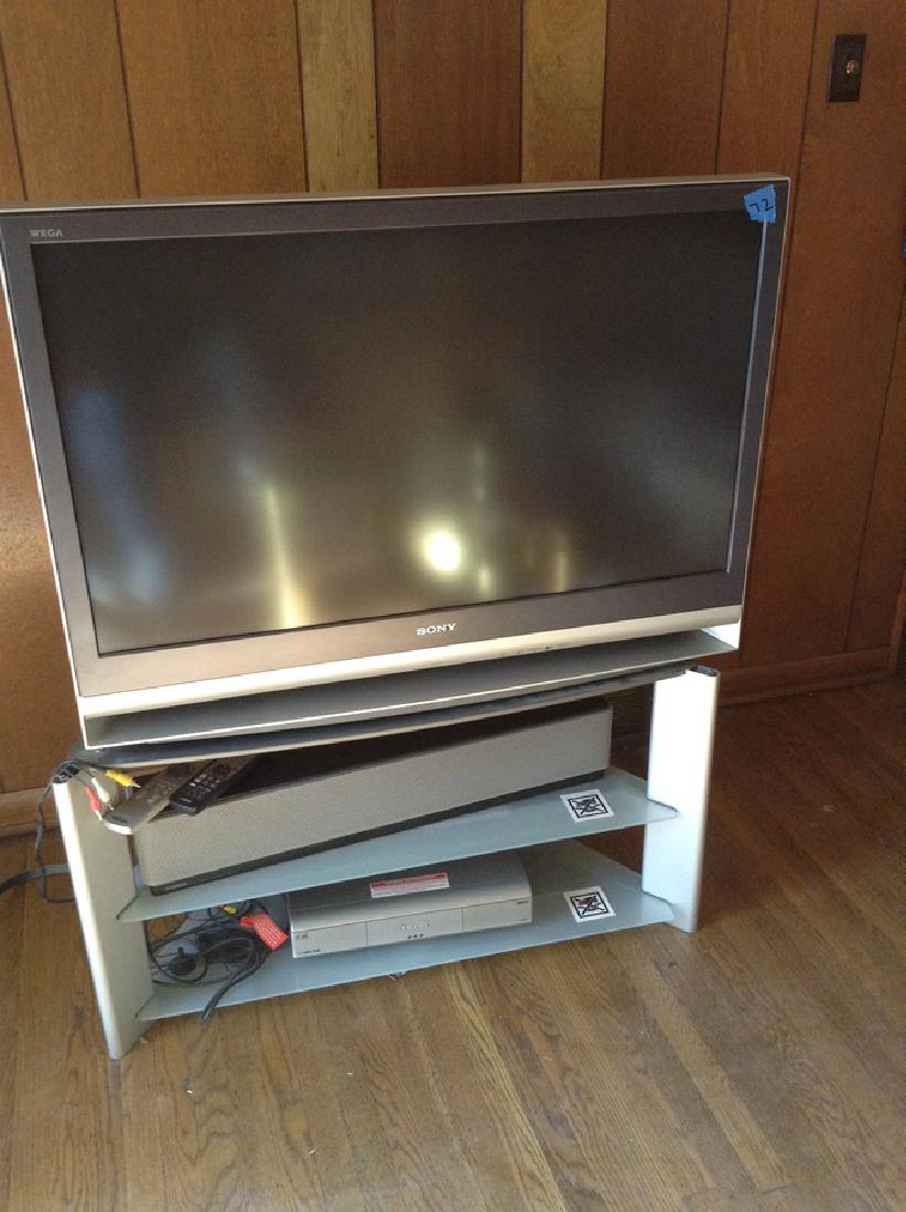 Sony TV w stand Yamaha Sound System (1 of 1)