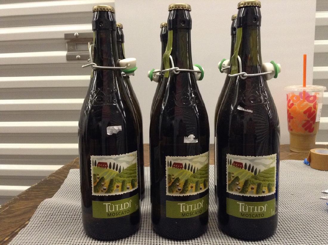 Tutibi Moscato Lot of 6 Bottles: Any contents in bottle is Free; You are bidding on the bottle & unbroken tax stamp