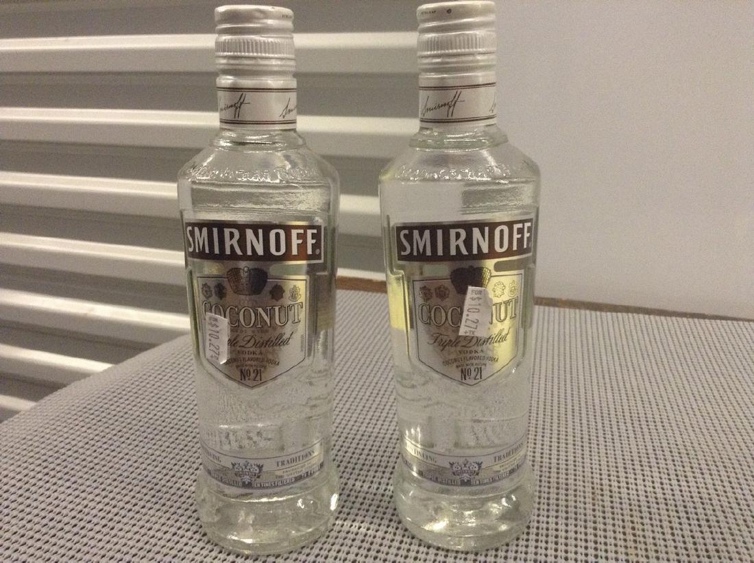 2 Bottles of Smirnoffs Coconut: Any contents in bottle is Free; You are bidding on the bottle & unbroken tax stamp