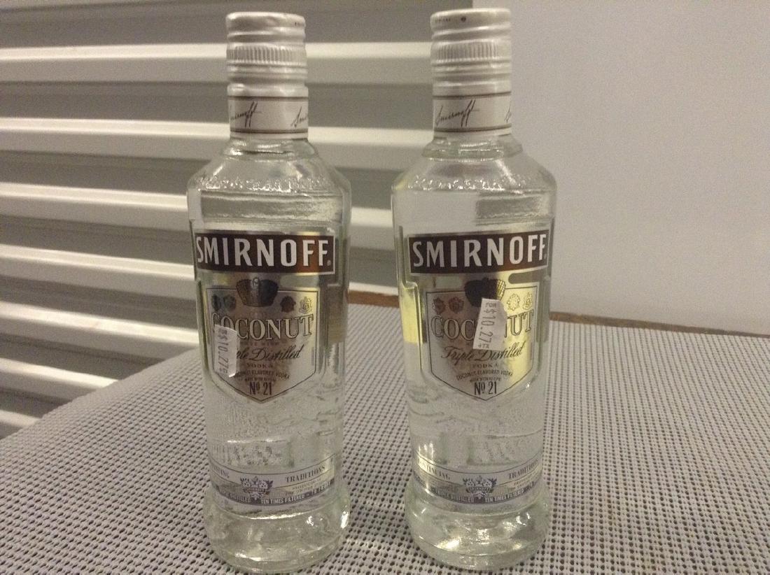 2 Bottles of Smirnoffs Coconut: Any contents in bottle is Free; You are bidding on the bottle & unbroken tax stamp