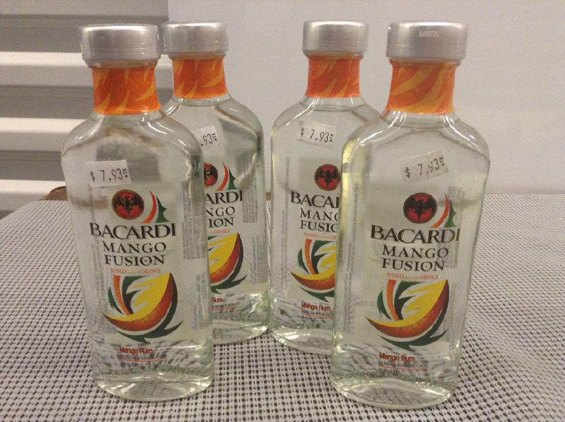 Lot of 4 Bacardi Mango Fusion Bottles: Any contents in bottle is Free; You are bidding on the bottle & unbroken tax stamp