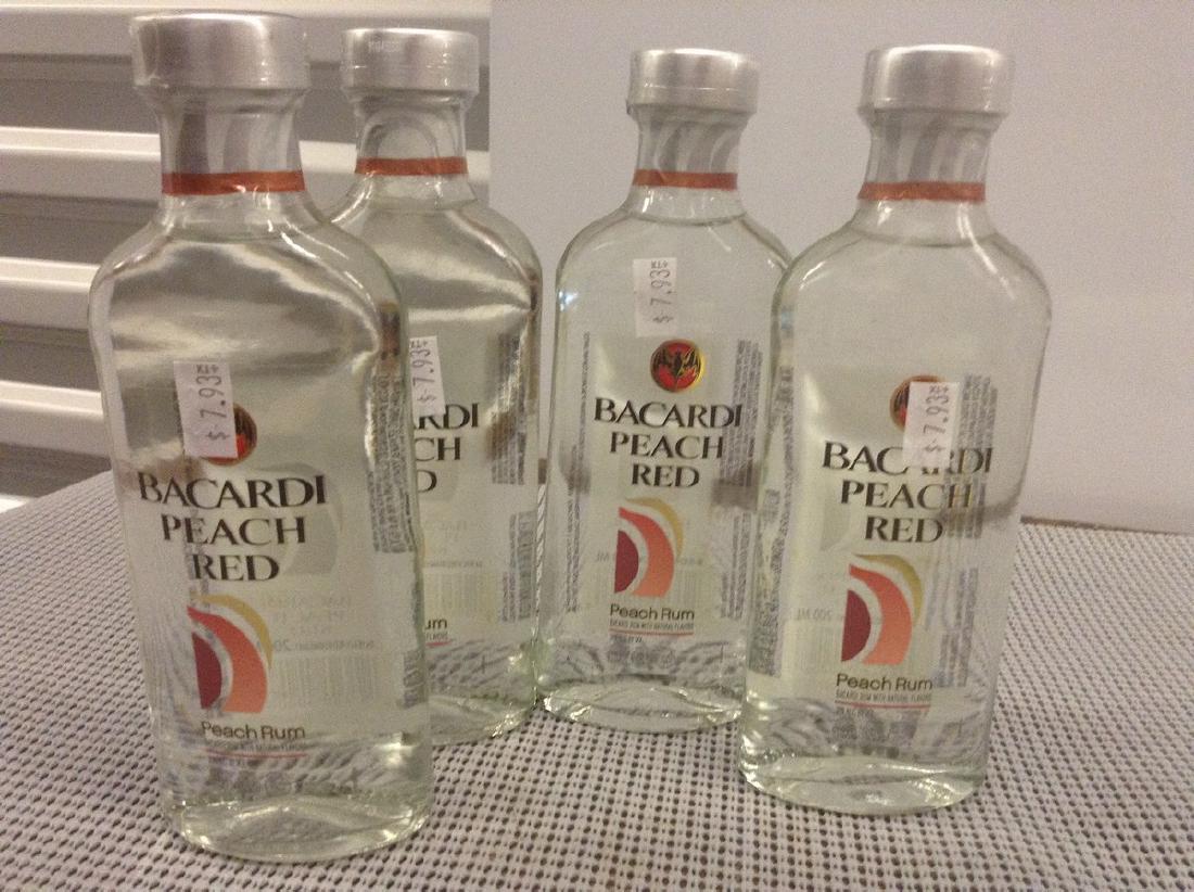 Lot of 4 Bacardi Peach Red: Any contents in bottle is Free; You are bidding on the bottle & unbroken tax stamp