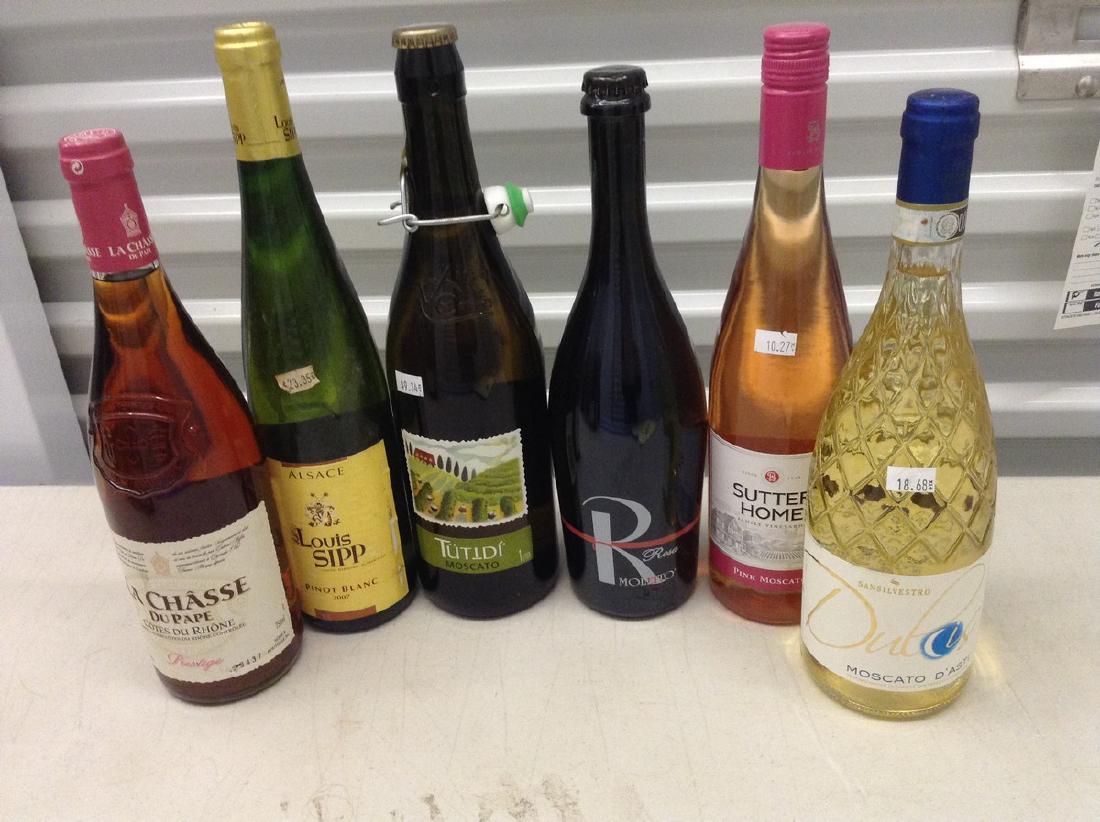 6 wine bottles: Any contents in bottle is Free; You are bidding on the bottle & unbroken tax stamp