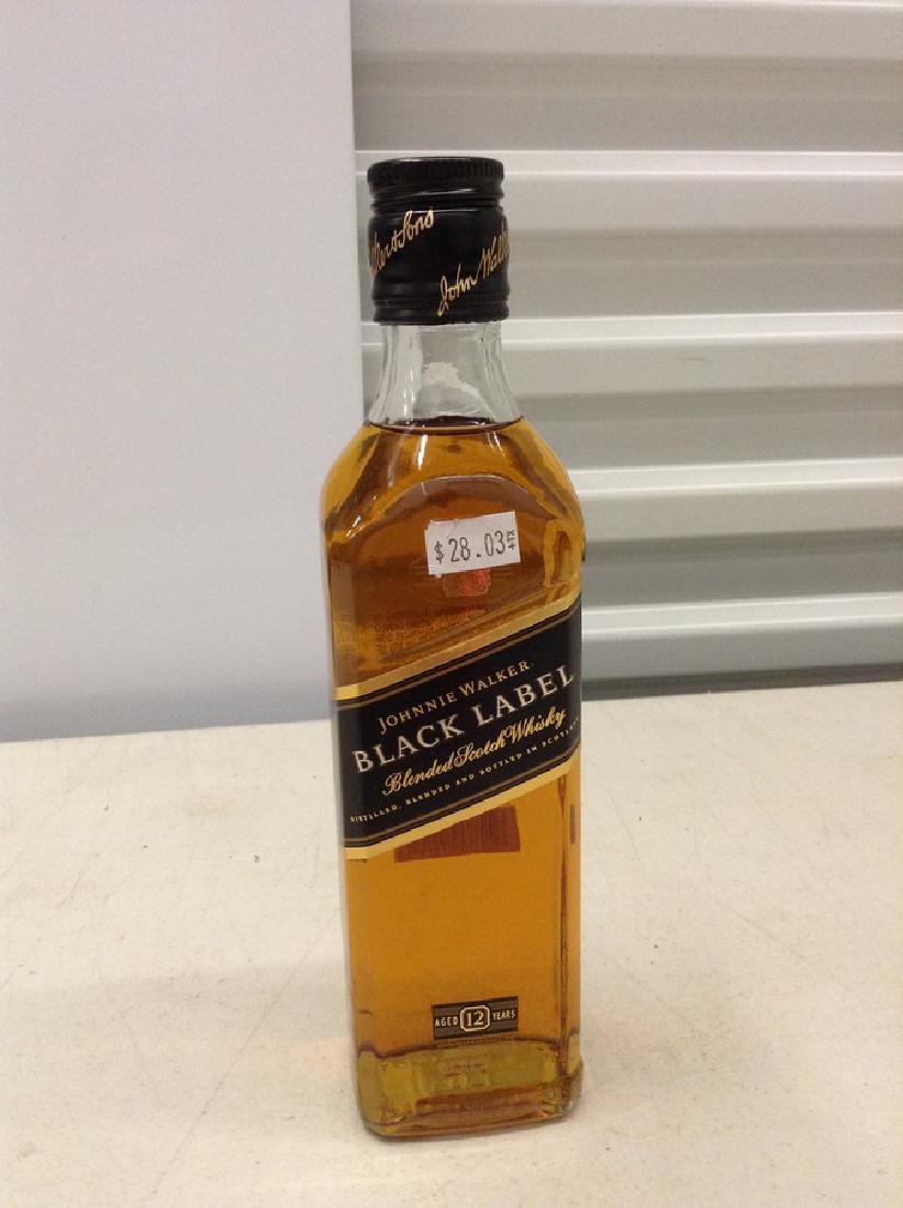 Johnnie Walker Black Label Blended Scotch Whiskey: Any contents in bottle is Free; You are bidding on the bottle & unbroken tax stamp