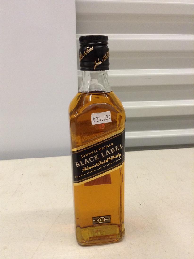 Johnnie Walker Black Label Blended Scotch Whiskey: Any contents in bottle is Free; You are bidding on the bottle & unbroken tax stamp