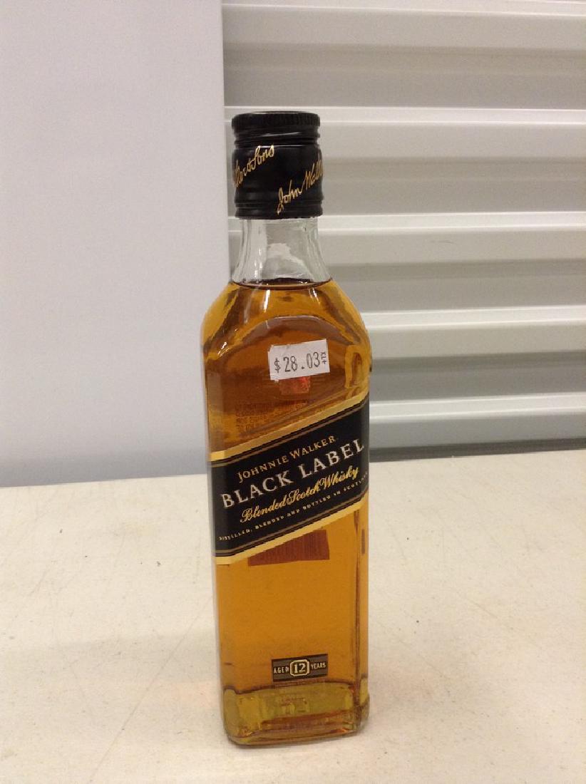 Johnnie Walker Black Label Blended Scotch Whiskey: Any contents in bottle is Free; You are bidding on the bottle & unbroken tax stamp