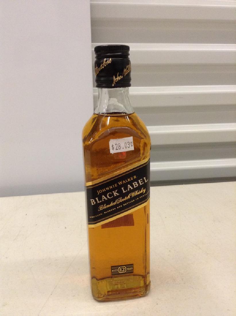 Johnnie Walker Black Label Blended Scotch Whiskey: Any contents in bottle is Free; You are bidding on the bottle & unbroken tax stamp