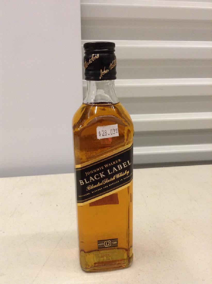 Johnnie Walker Black Label Blended Scotch Whiskey: Any contents in bottle is Free; You are bidding on the bottle & unbroken tax stamp