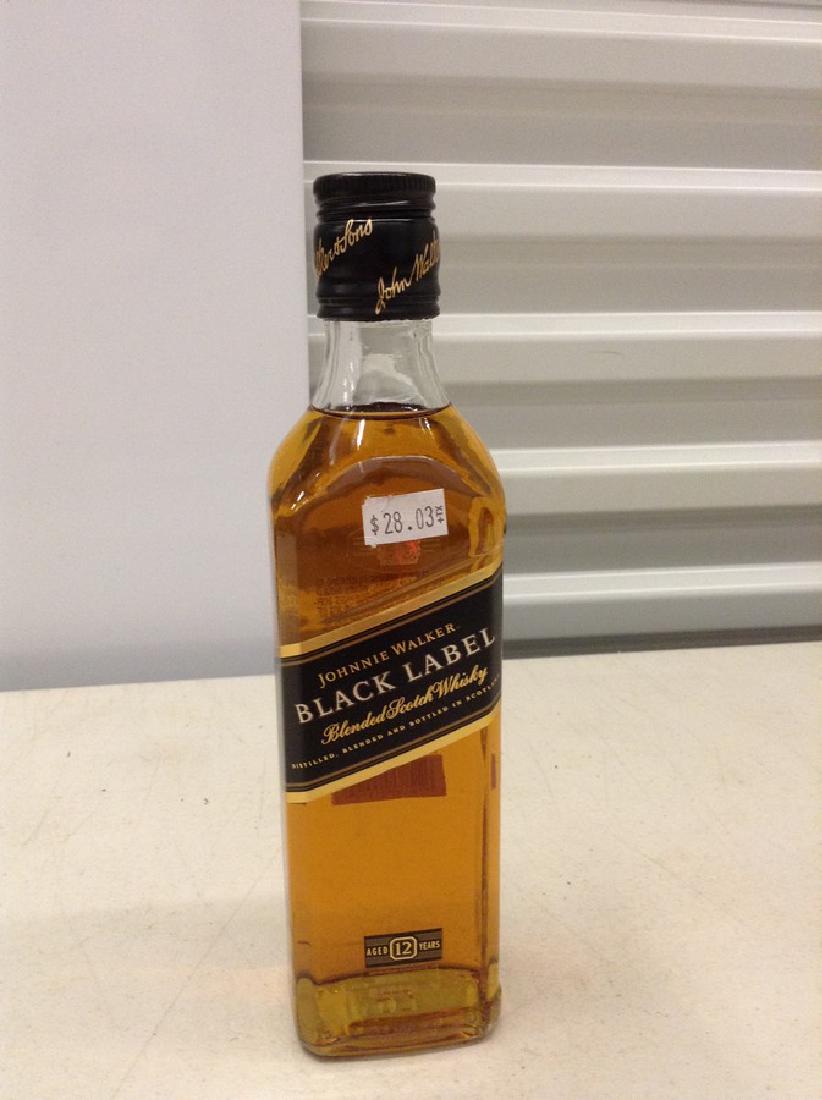 Johnnie Walker Black Label Blended Scotch Whiskey: Any contents in bottle is Free; You are bidding on the bottle & unbroken tax stamp