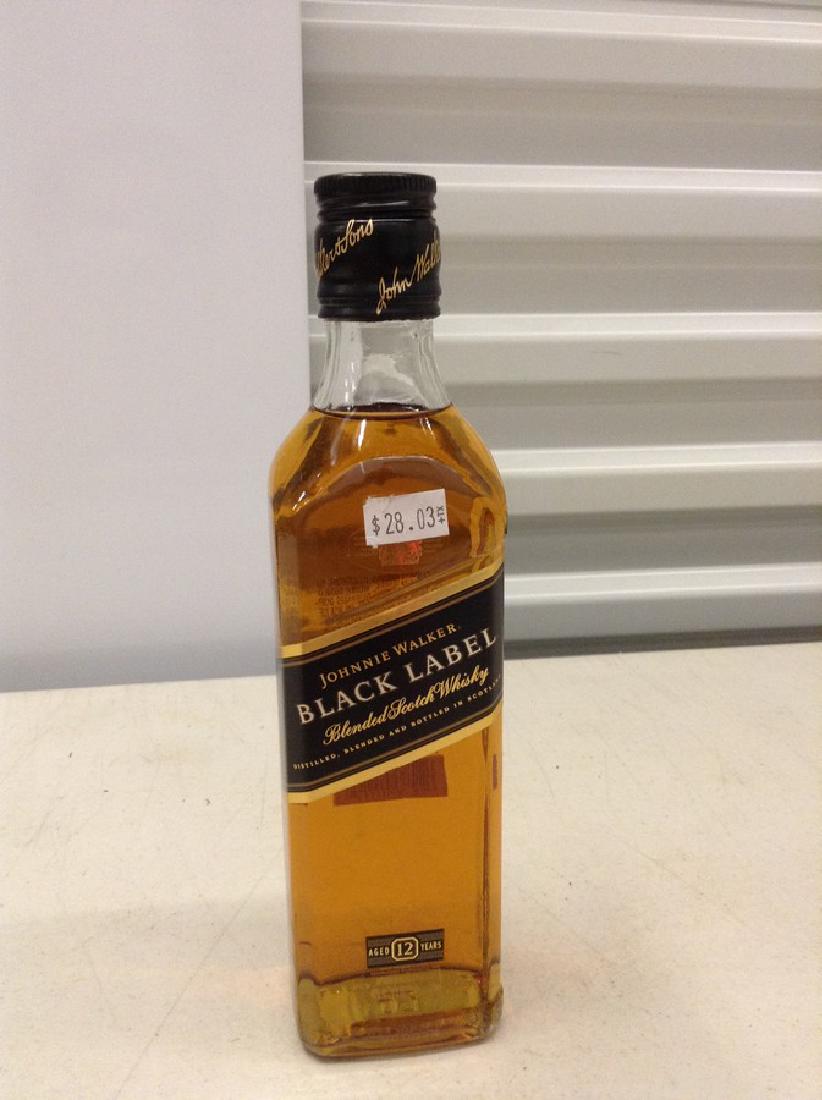 Johnnie Walker Black Label Blended Scotch Whiskey: Any contents in bottle is Free; You are bidding on the bottle & unbroken tax stamp