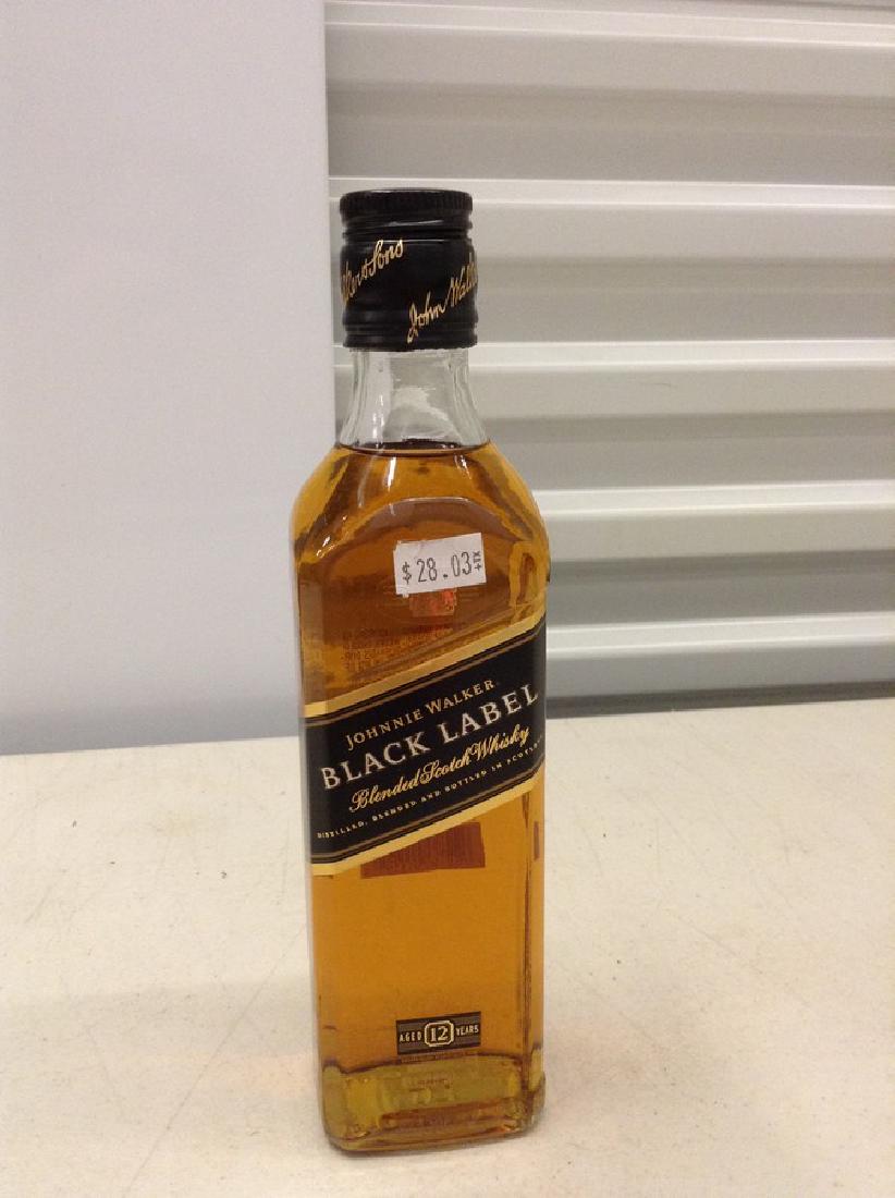 Johnnie Walker Black Label Blended Scotch Whiskey: Any contents in bottle is Free; You are bidding on the bottle & unbroken tax stamp