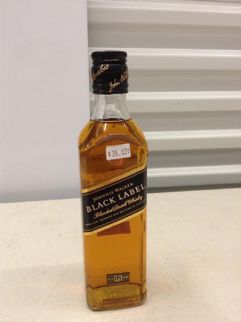 Johnnie Walker Black Label Blended Scotch Whiskey: Any contents in bottle is Free; You are bidding on the bottle & unbroken tax stamp