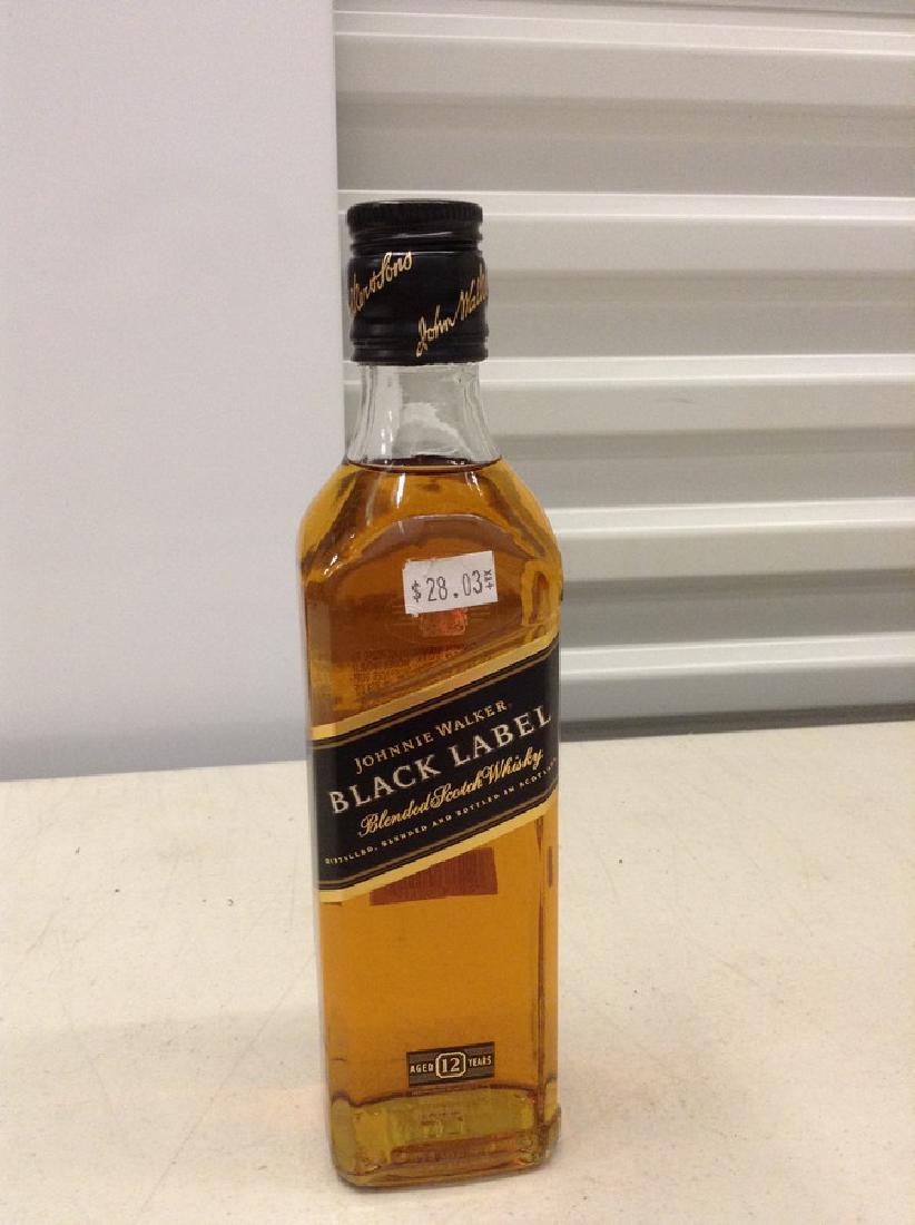 Johnnie Walker Black Label Blended Scotch Whiskey: Any contents in bottle is Free; You are bidding on the bottle & unbroken tax stamp
