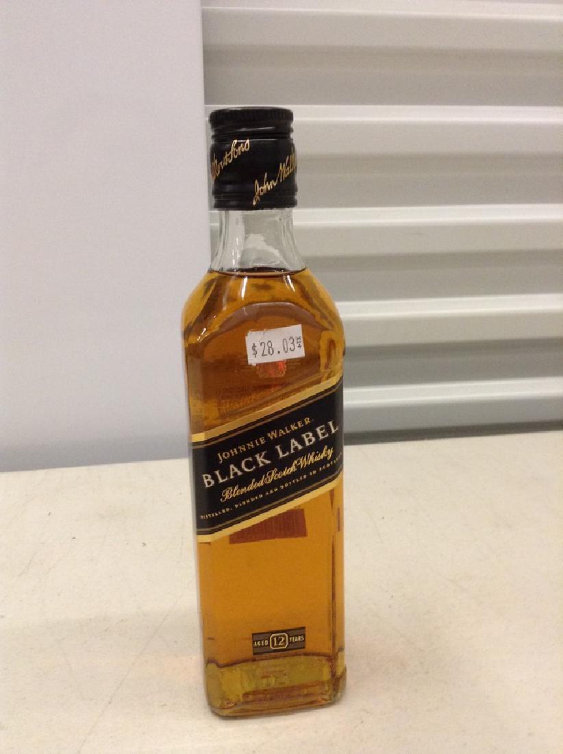 Johnnie Walker Black Label Blended Scotch Whiskey: Any contents in bottle is Free; You are bidding on the bottle & unbroken tax stamp
