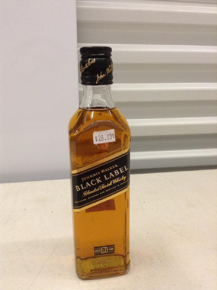 Johnnie Walker Black Label Blended Scotch Whiskey: Any contents in bottle is Free; You are bidding on the bottle & unbroken tax stamp