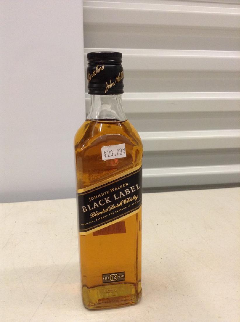 Johnnie Walker Black Label Blended Scotch Whiskey: Any contents in bottle is Free; You are bidding on the bottle & unbroken tax stamp