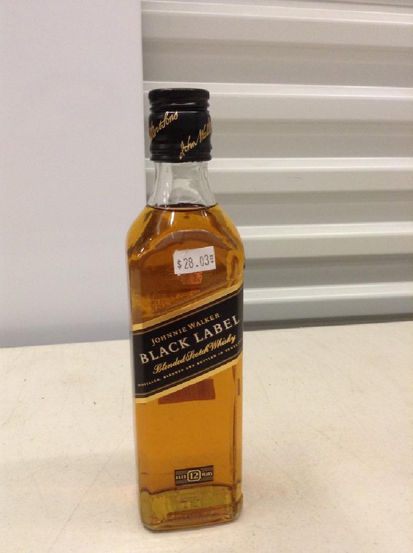 Johnnie Walker Black Label Blended Scotch Whiskey: Any contents in bottle is Free; You are bidding on the bottle & unbroken tax stamp