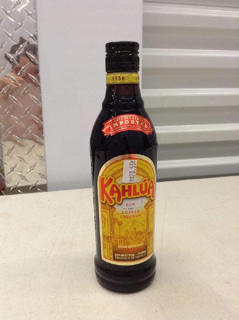 1936 Kahlua Rum and coffee Liqueur: Any contents in bottle is Free; You are bidding on the bottle & unbroken tax stamp