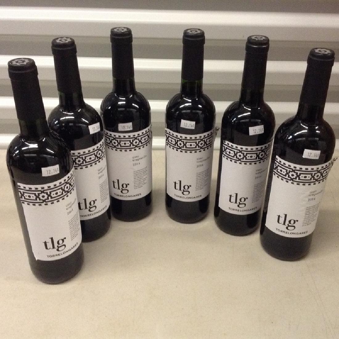 Lot of 6 bottles of wine Tlg- tinto tempranilo: Any contents in bottle is Free; You are bidding on the bottle & unbroken tax stamp