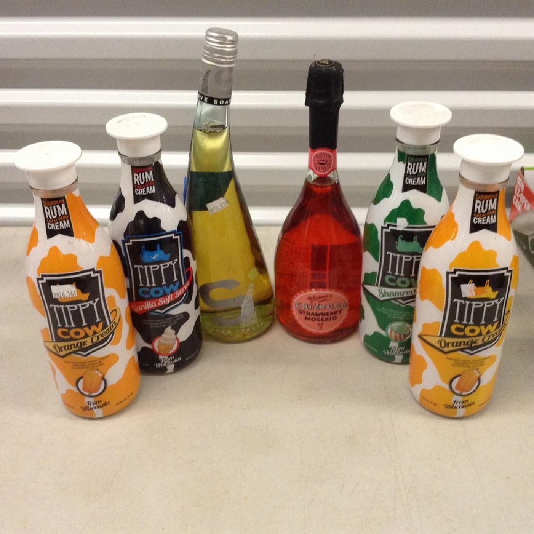 lot of 6 bottles of wine: Any contents in bottle is Free; You are bidding on the bottle & unbroken tax stamp