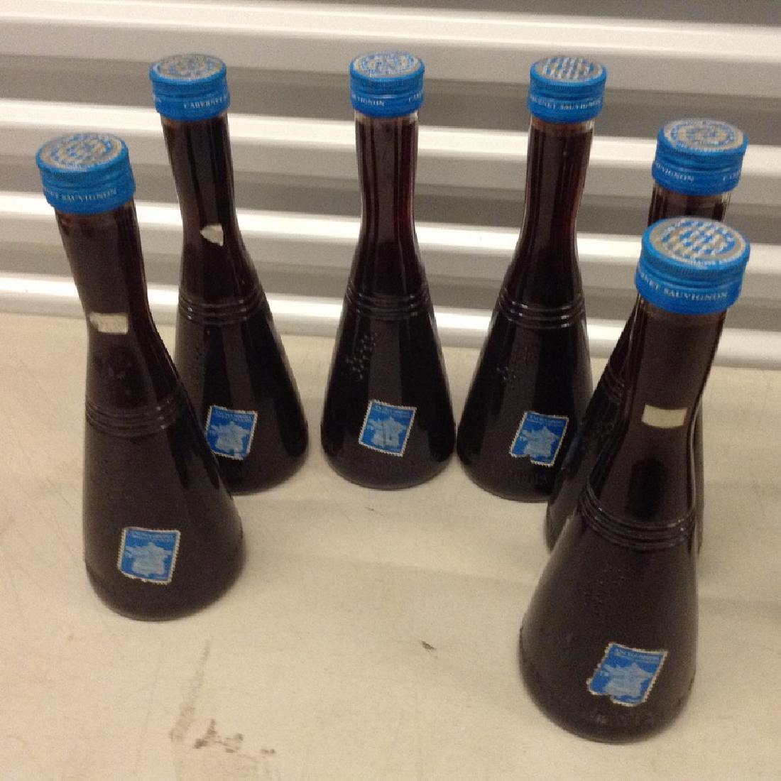 Lot of 6 encyclopedia bottles: Any contents in bottle is Free; You are bidding on the bottle & unbroken tax stamp