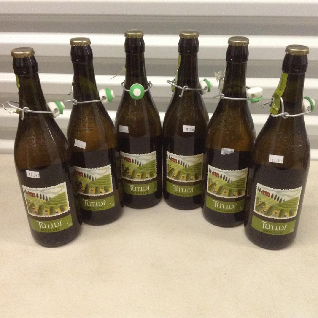 lot of 6 Tutidi' Moscato: Any contents in bottle is Free; You are bidding on the bottle & unbroken tax stamp