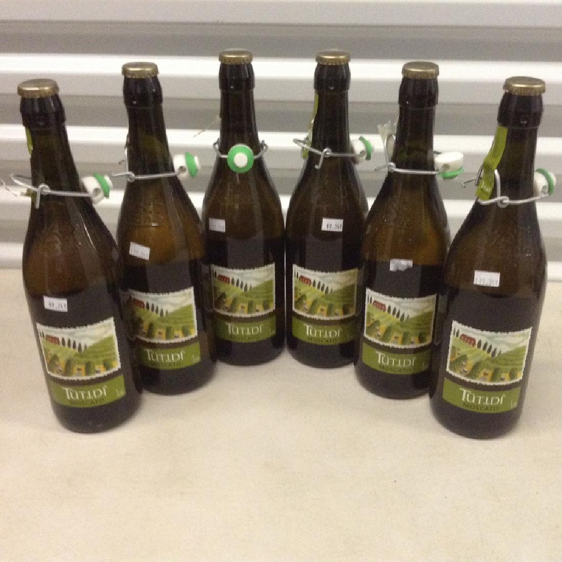 lot of 6 Tutidi' Moscato: Any contents in bottle is Free; You are bidding on the bottle & unbroken tax stamp