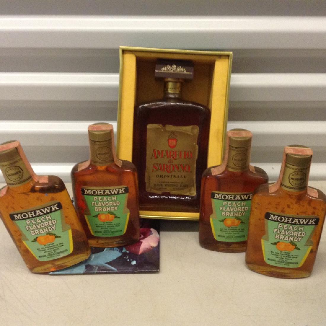 lot of Amarettodi Saronno and flavored Brandy: Any contents in bottle is Free; You are bidding on the bottle & unbroken tax stamp