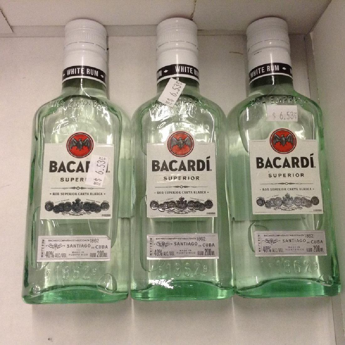 Lot of Bacardi Superior: Any contents in bottle is Free; You are bidding on the bottle & unbroken tax stamp