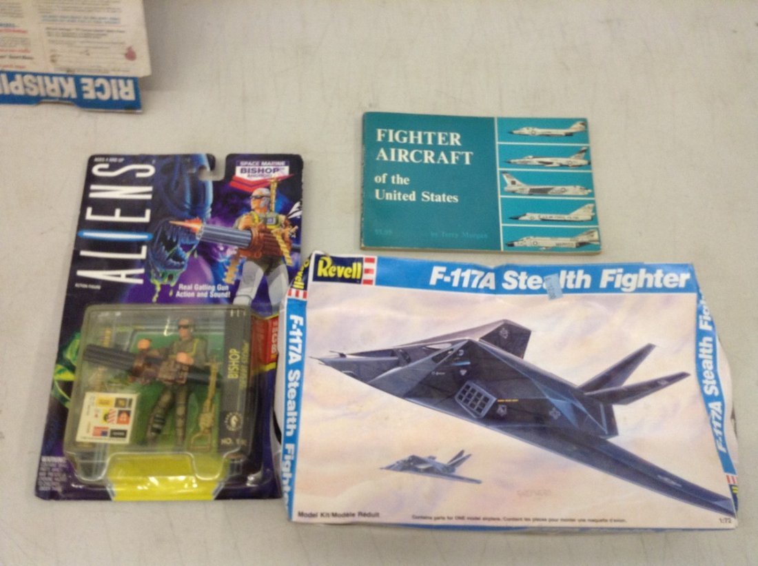 airplane model and alien action figure: airplane model and alien action figure