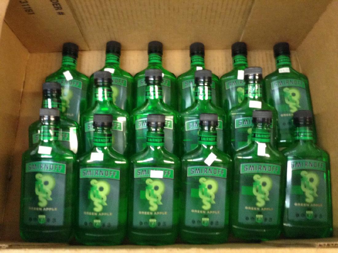 lot of 17 Smirnoff green apple: Any contents in bottle is Free; You are bidding on the bottle & unbroken tax stamp