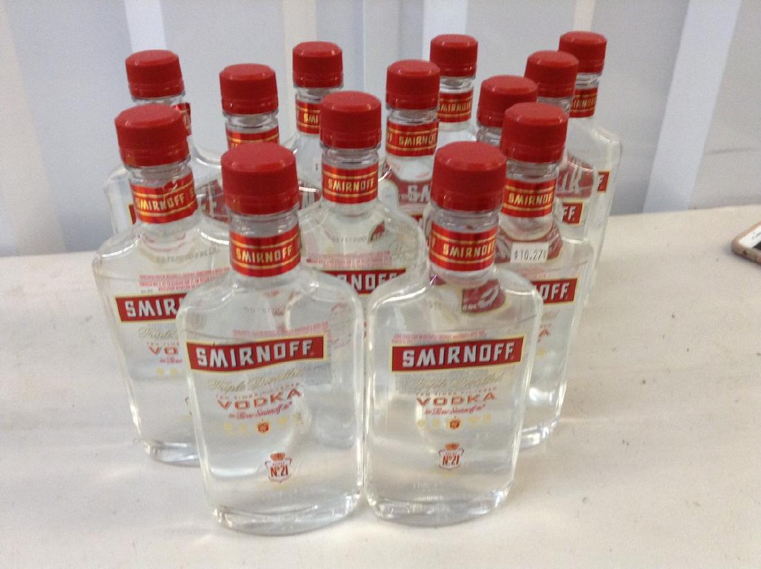 Smirnoff-vodka lot of 13: Any contents in bottle is Free; You are bidding on the bottle & unbroken tax stamp