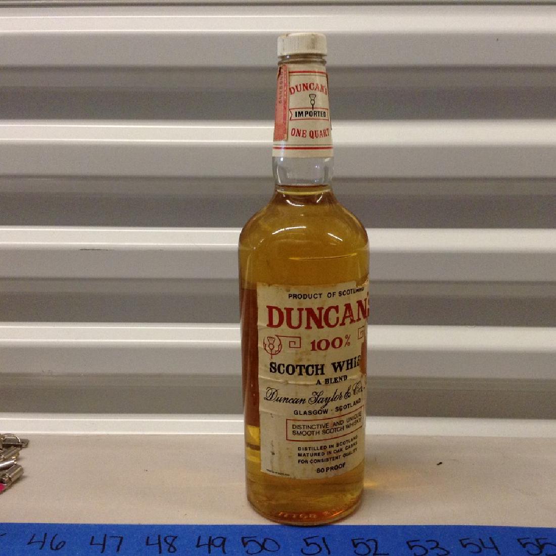 Duncan's Scotch Whiskey oene Quart: Any contents in bottle is Free; You are bidding on the bottle & unbroken tax stamp