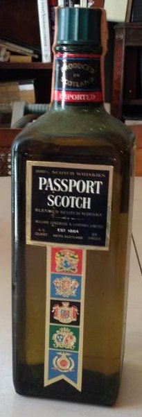 imported passport scotch WHISKY VINTAGE 1970'S: Any contents in bottle is Free; You are bidding on the bottle & unbroken tax stamp
