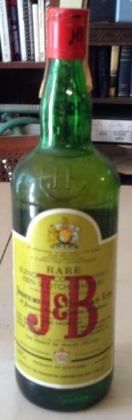 J&B Rare Blended Scotch Whiskey: Any contents in bottle is Free; You are bidding on the bottle & unbroken tax stamp