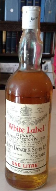 White Label Dewar Blended Scotch: Any contents in bottle is Free; You are bidding on the bottle & unbroken tax stamp