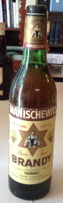 Manischewitz Rare Fine Brandy: Any contents in bottle is Free; You are bidding on the bottle & unbroken tax stamp