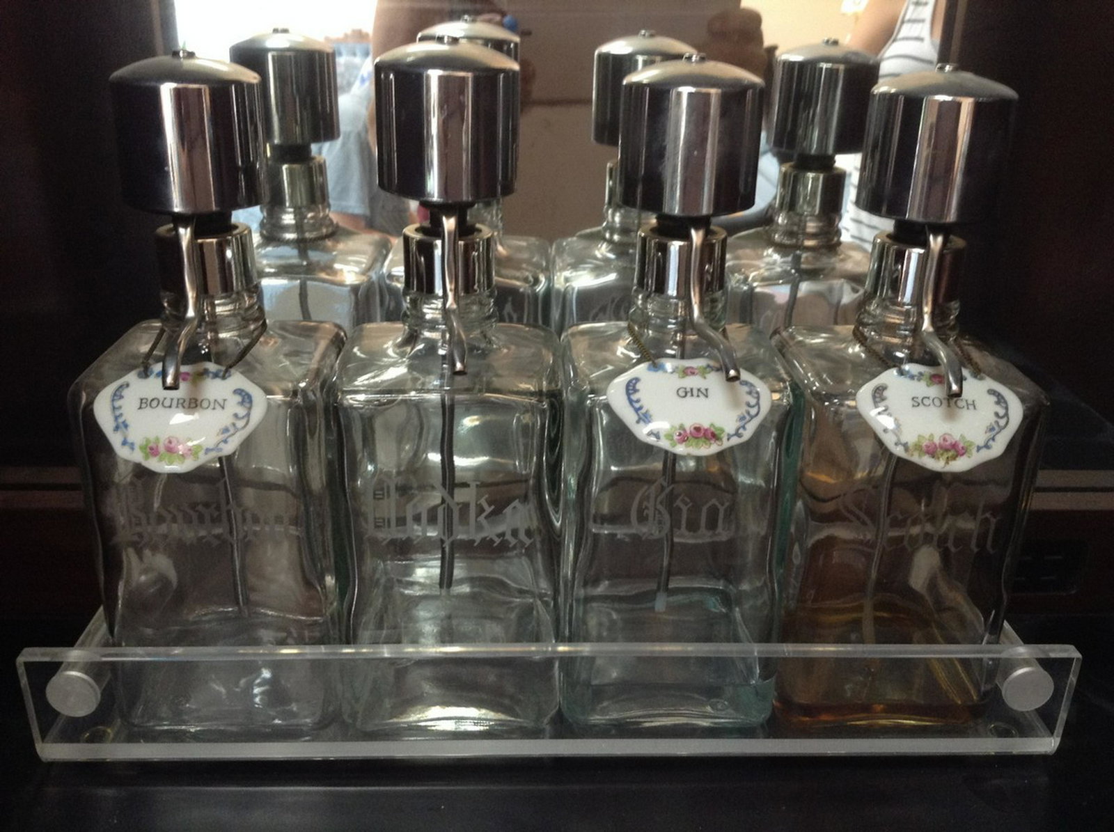 Bourbon, vodka, gin and scotch bottles with tags and: Any contents in bottle is Free; You are bidding on the bottle & unbroken tax stamp