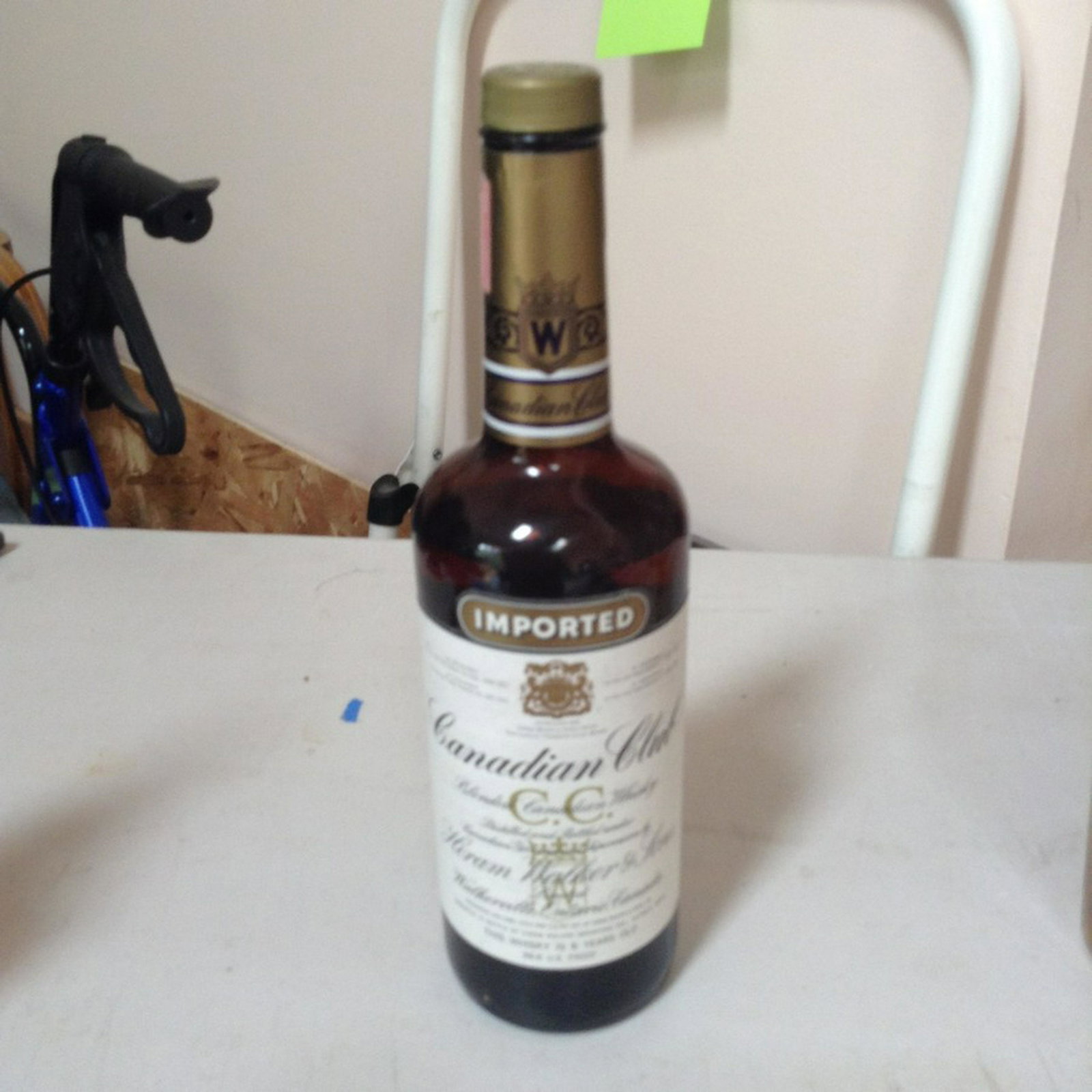 Canadian Club Blended Canadian Whiskey: Any contents in bottle is Free; You are bidding on the bottle & unbroken tax stamp