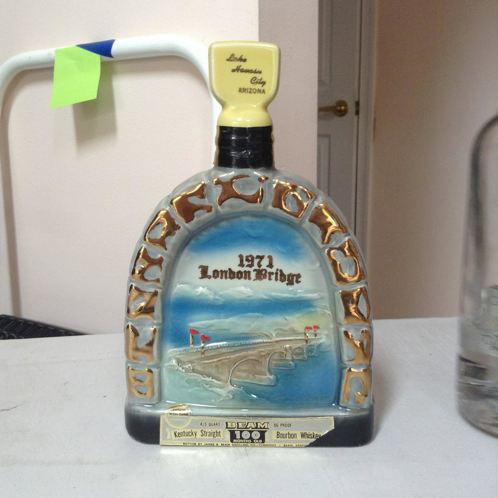 1971 London Bridge Kentucky Straight Bourbon whiskey: Any contents in bottle is Free; You are bidding on the bottle & unbroken tax stamp
