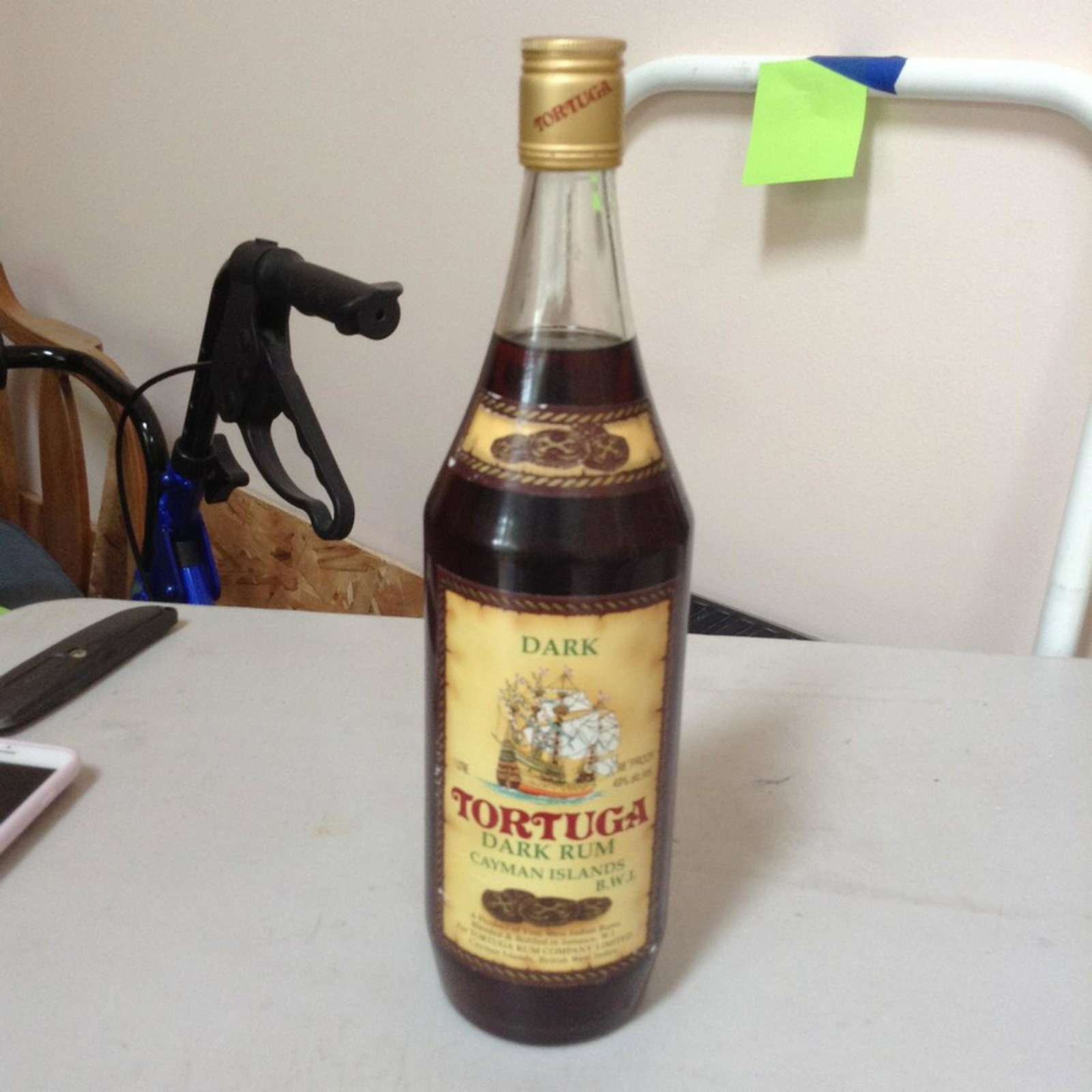 Tortuga Dark Rum Cayman Islands: Any contents in bottle is Free; You are bidding on the bottle & unbroken tax stamp