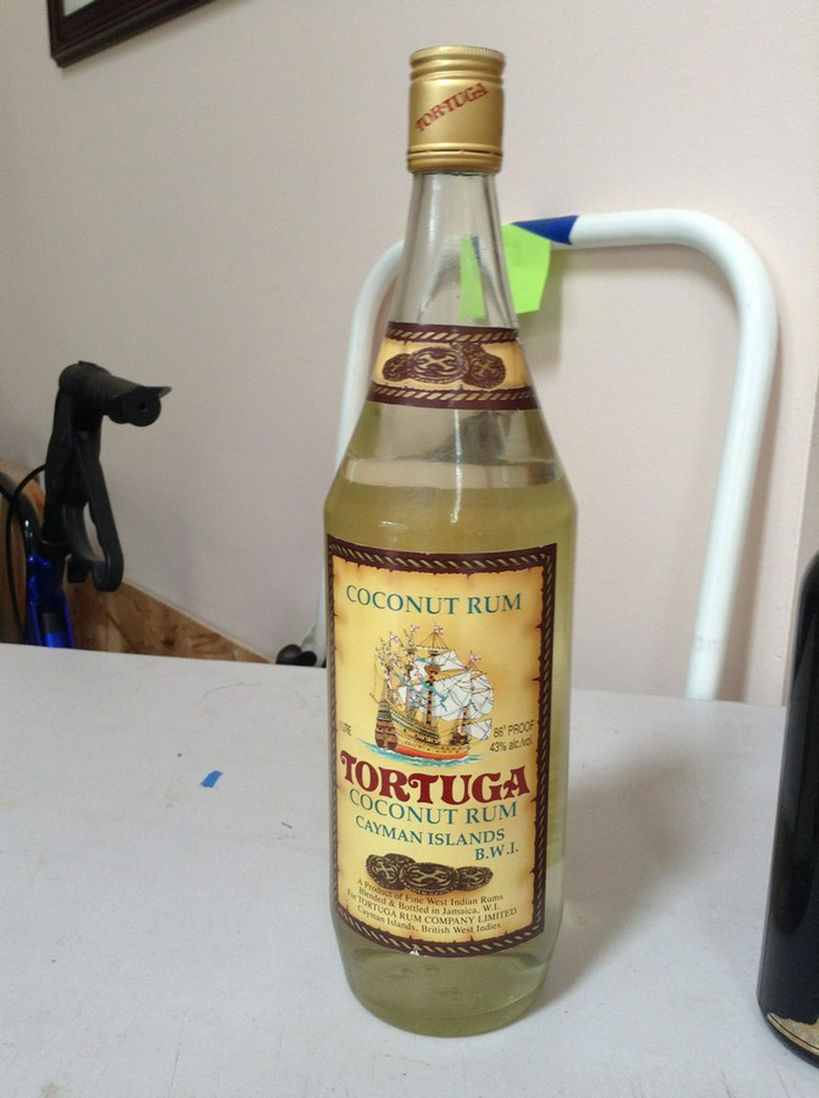Tortuga coconut rum Cayman islands: Any contents in bottle is Free; You are bidding on the bottle & unbroken tax stamp