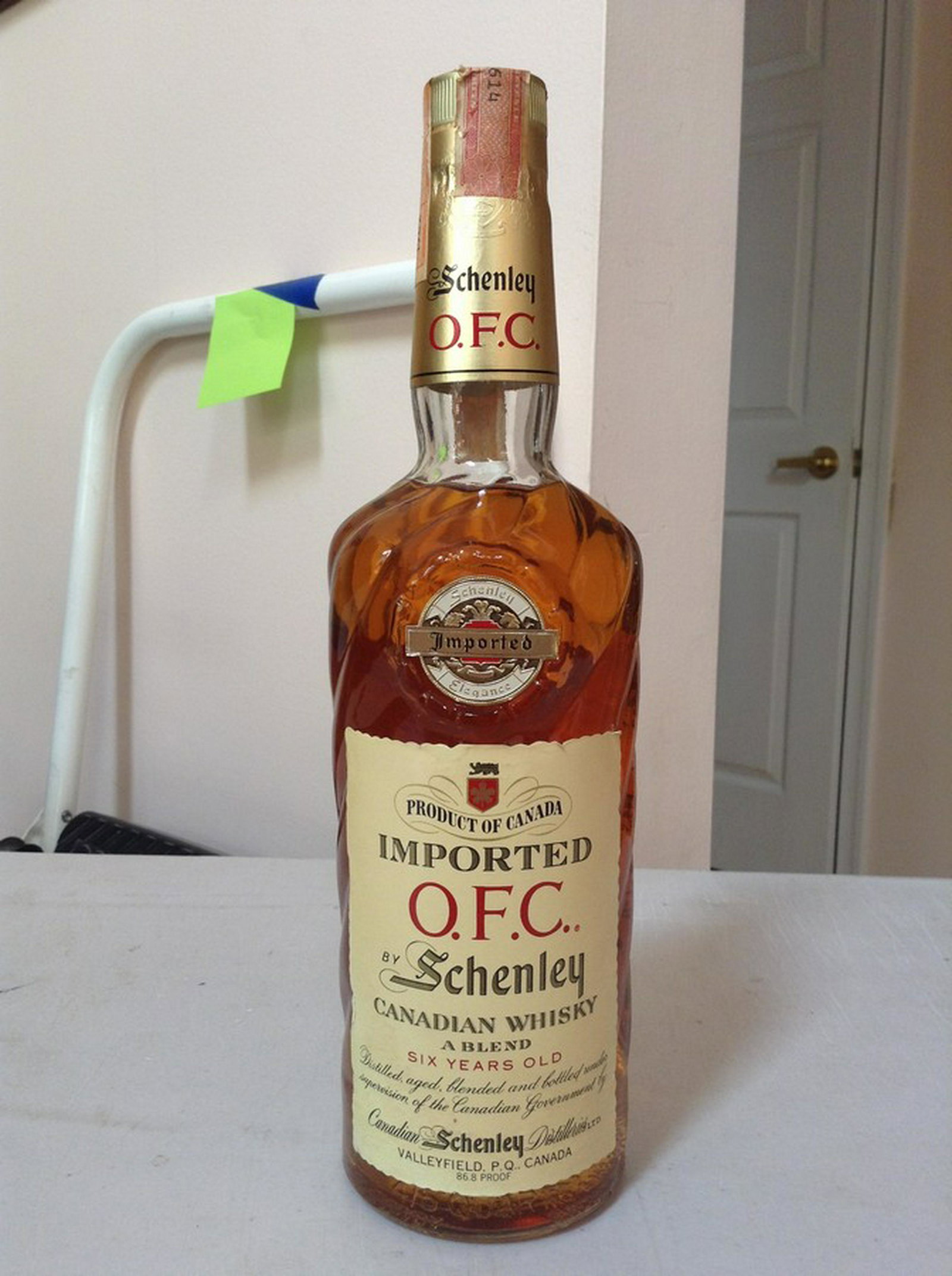 imported OFC by Schenley Canadian whiskey: Any contents in bottle is Free; You are bidding on the bottle & unbroken tax stamp