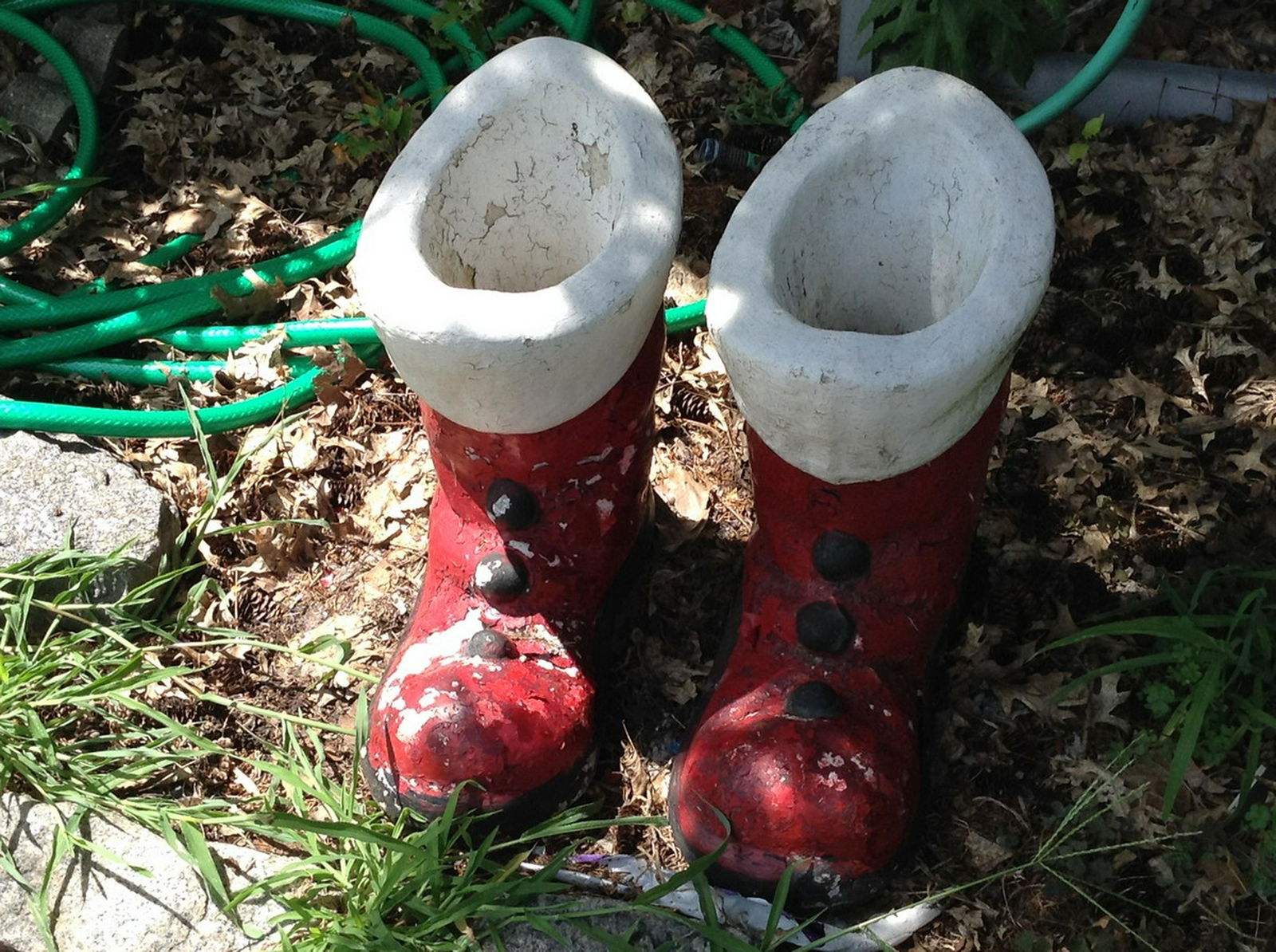 pair of cement Santa boots: pair of cement Santa boots