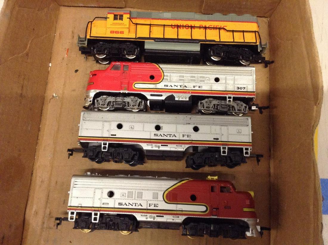 lot of three HO train engines and one train car (1 of 1)